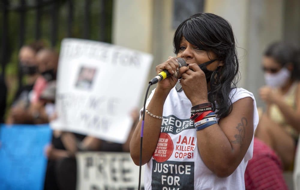 At a protest by Mass Action Against Police Brutality on the steps of the Massachusetts State House, Hope Coleman talks about the death of her son, Terrence Coleman. (Robin Lubbock/WBUR)
