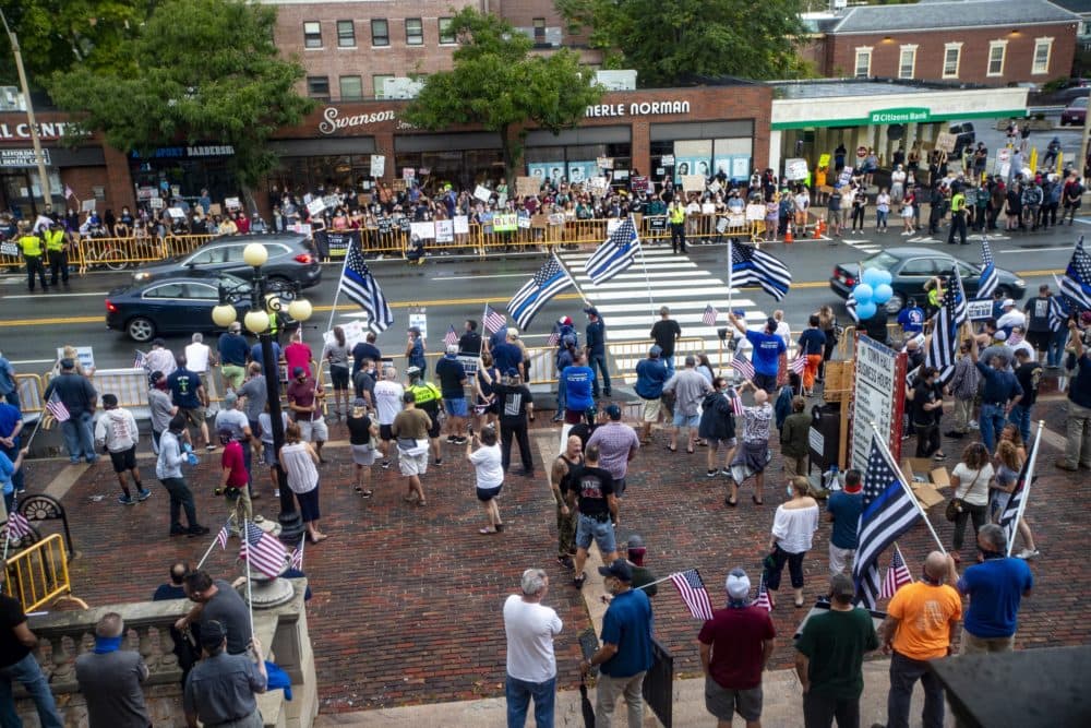 Separated by Massachusetts Avenue, Back the Blue supporters and Black Lives Matter counterprotesters held opposing rallies in front of Arlington City Hall. (Jesse Costa/WBUR)