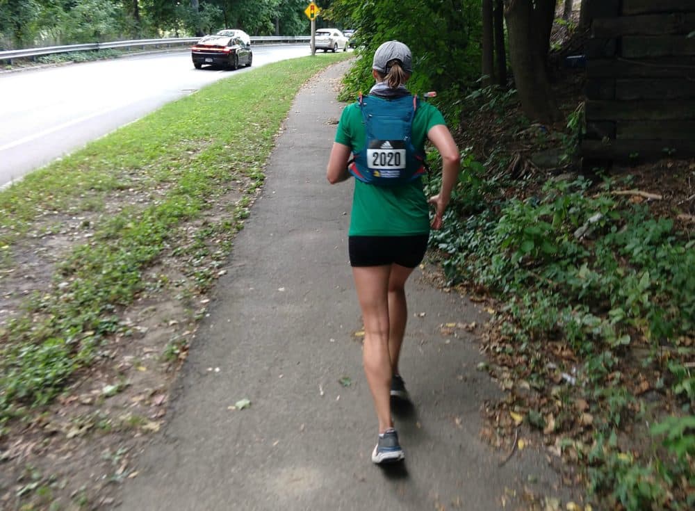 The author, Dianna Bell, running up a hill in Arlington during the last four miles of the virtual Boston Marathon, Sept. 13, 2020. (Courtesy Patrick Stanton)
