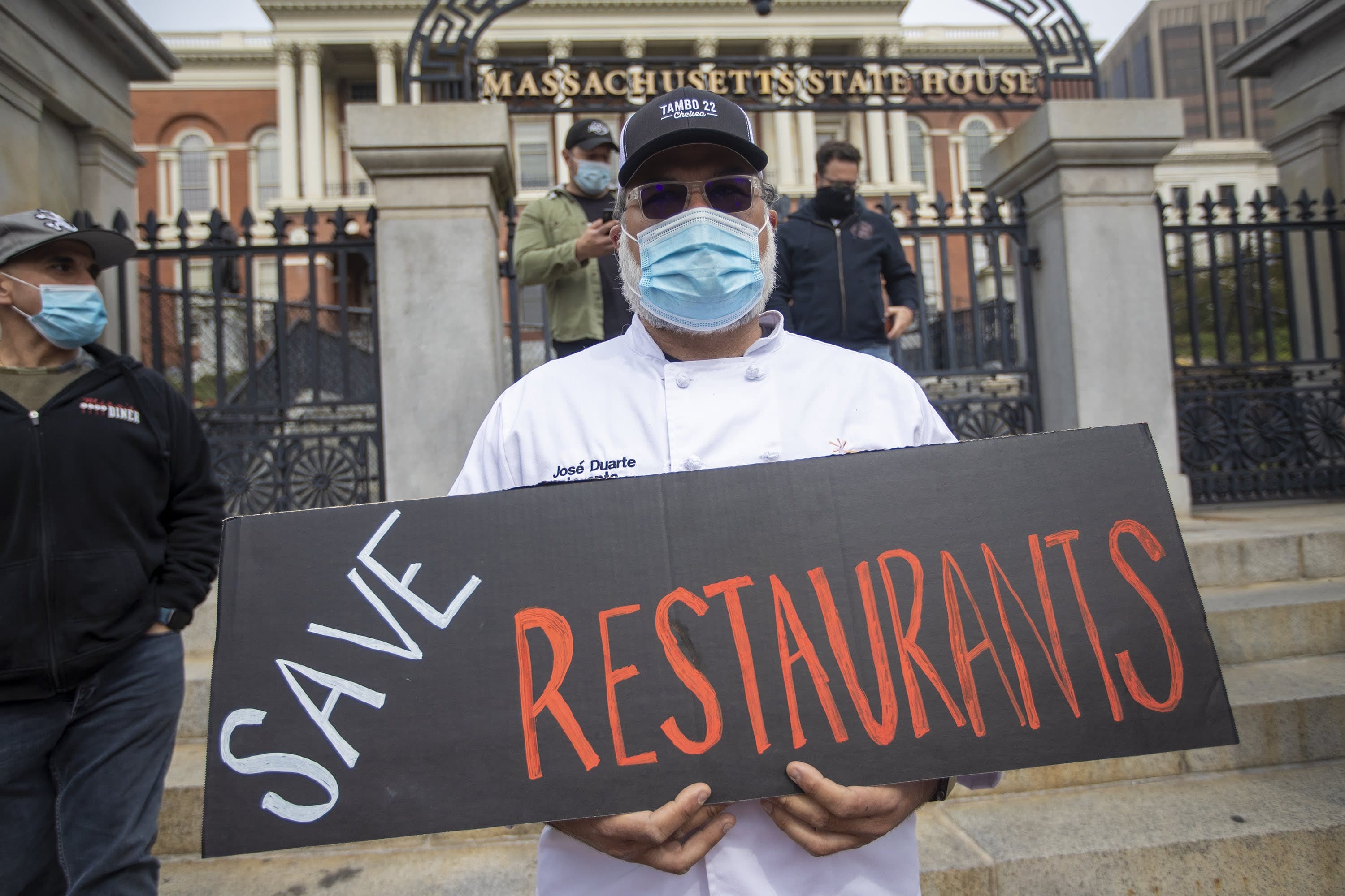 Massachusetts restaurant owners and chefs gathered in front of the State House to show support for legislation that would provide aid to struggling restaurants during the coronavirus pandemic. (Jesse Costa/WBUR)