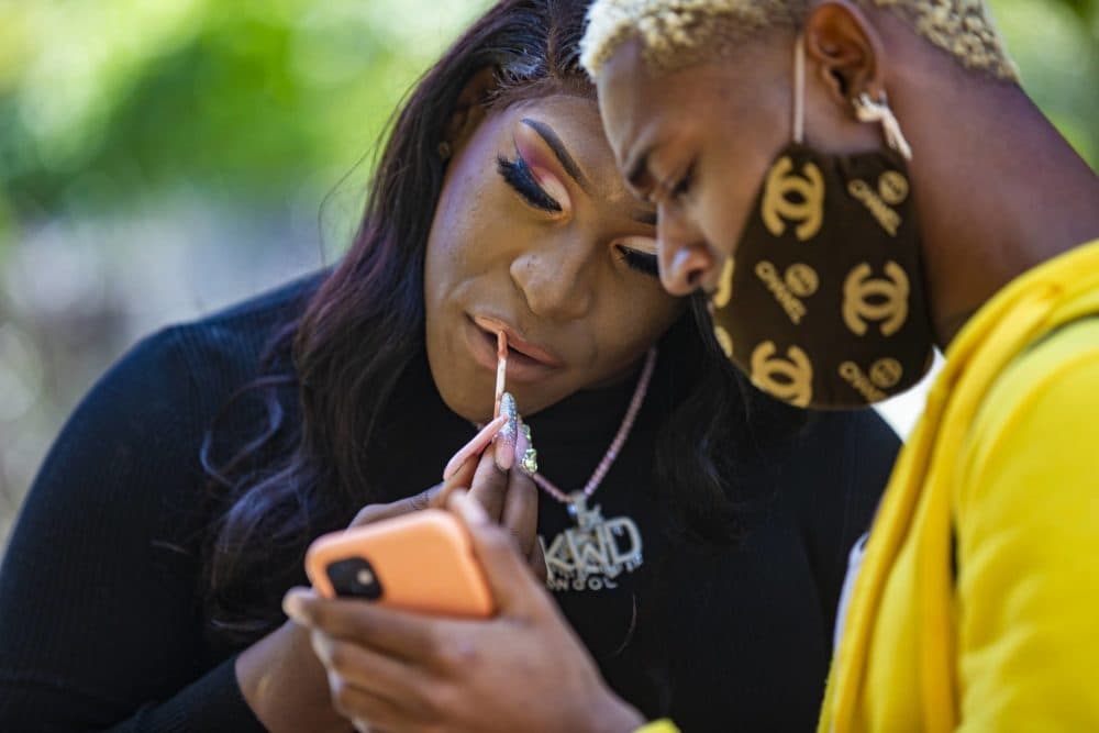 Rapper Kweeng Doll applies make up before an interview. (Jesse Costa/WBUR)