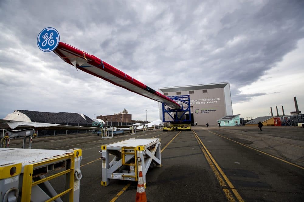 Massachusetts Clean Energy Center and GE unveil the Haliade-X 12MW offshore wind turbine blade at the Wind Technology Testing Center in Boston. (Jesse Costa/WBUR)