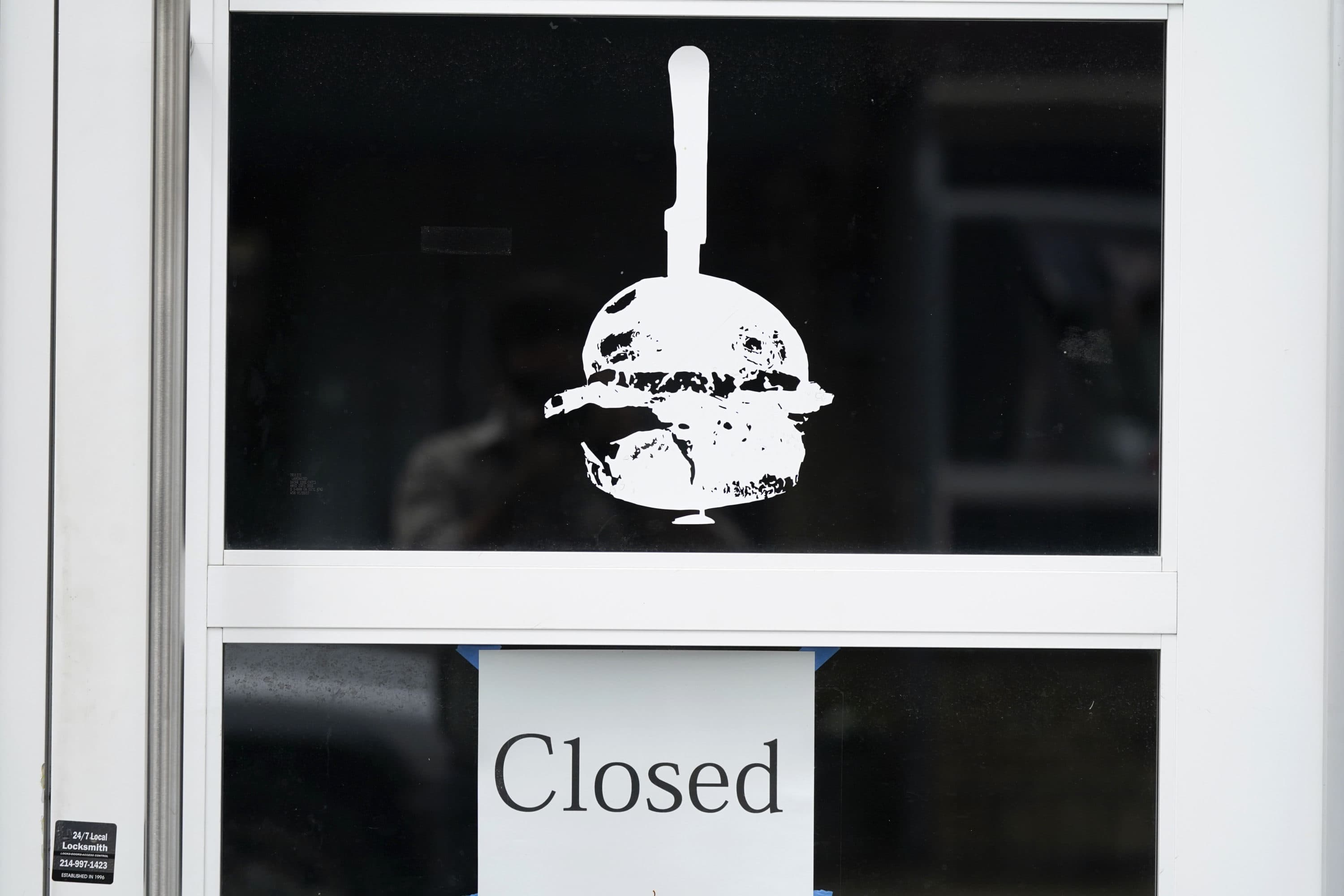 A sign announces the status of a closed burger eatery in Dallas, Sept. 2, 2020. (LM Otero/AP)