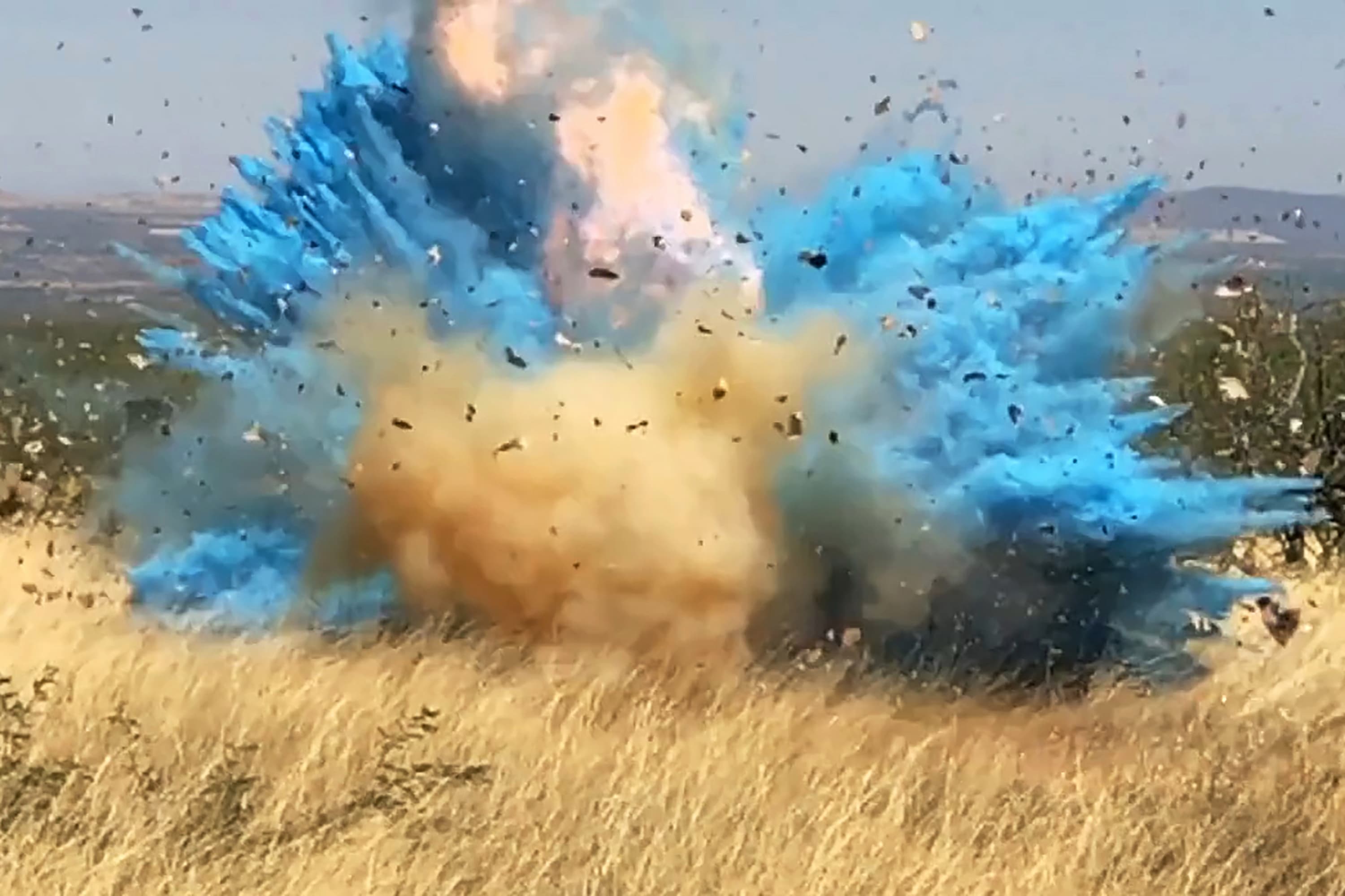 This April 23, 2017, photo from video provided by the U.S. Forest Service shows a gender reveal event in the Santa Rita Mountain's foothills, southeast of Tucson, Ariz. The explosion from the reveal ignited the 47,000-acre Sawmill Fire. A wildfire east of Los Angeles on Sept. 5, 2020, was sparked by a device a couple used to reveal their baby's gender that ignited in dry grasses in Yucaipa, Calif. It has prompted evacuations in parts of Yucaipa and nearby areas, and has burned thousands of acres. (U.S. Forest Service via AP, File)