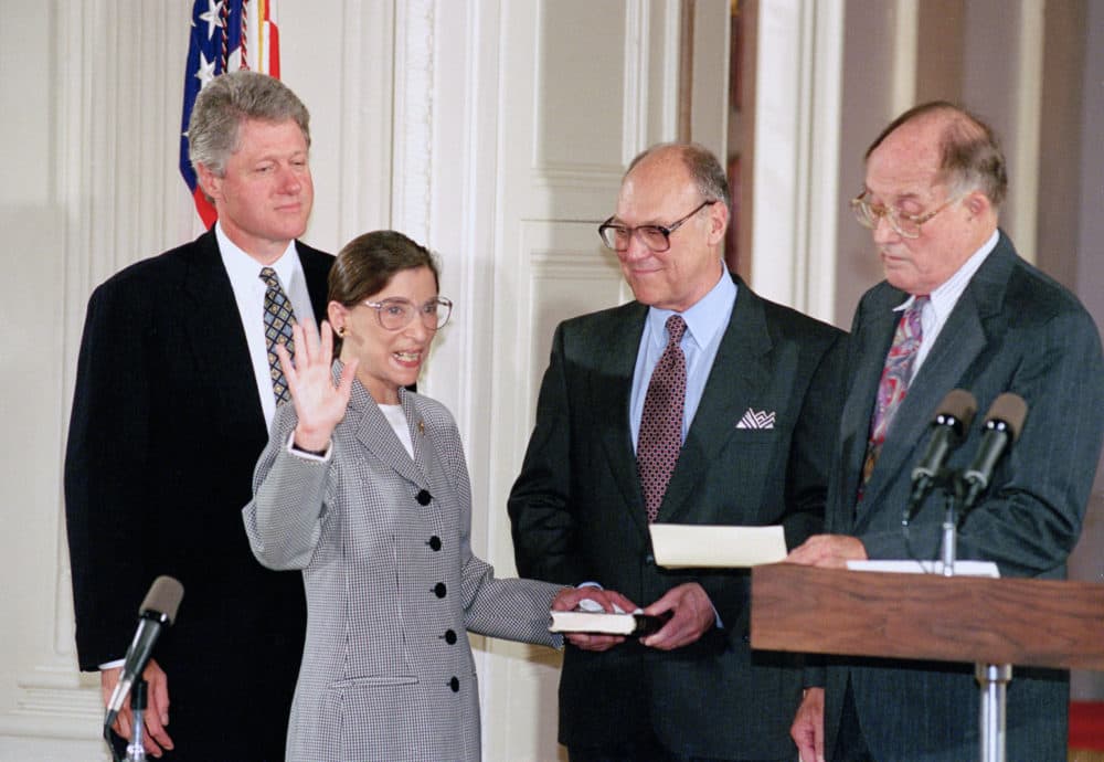 In this Aug. 10, 1993, file photo, Supreme Court Justice Ruth Bader Ginsburg takes the court oath from Chief Justice William Rehnquist, right, during a ceremony in the East Room of the White House in Washington. Ginsburg's husband Martin holds the Bible and President Bill Clinton watches at left. (Marcy Nighswander/AP)