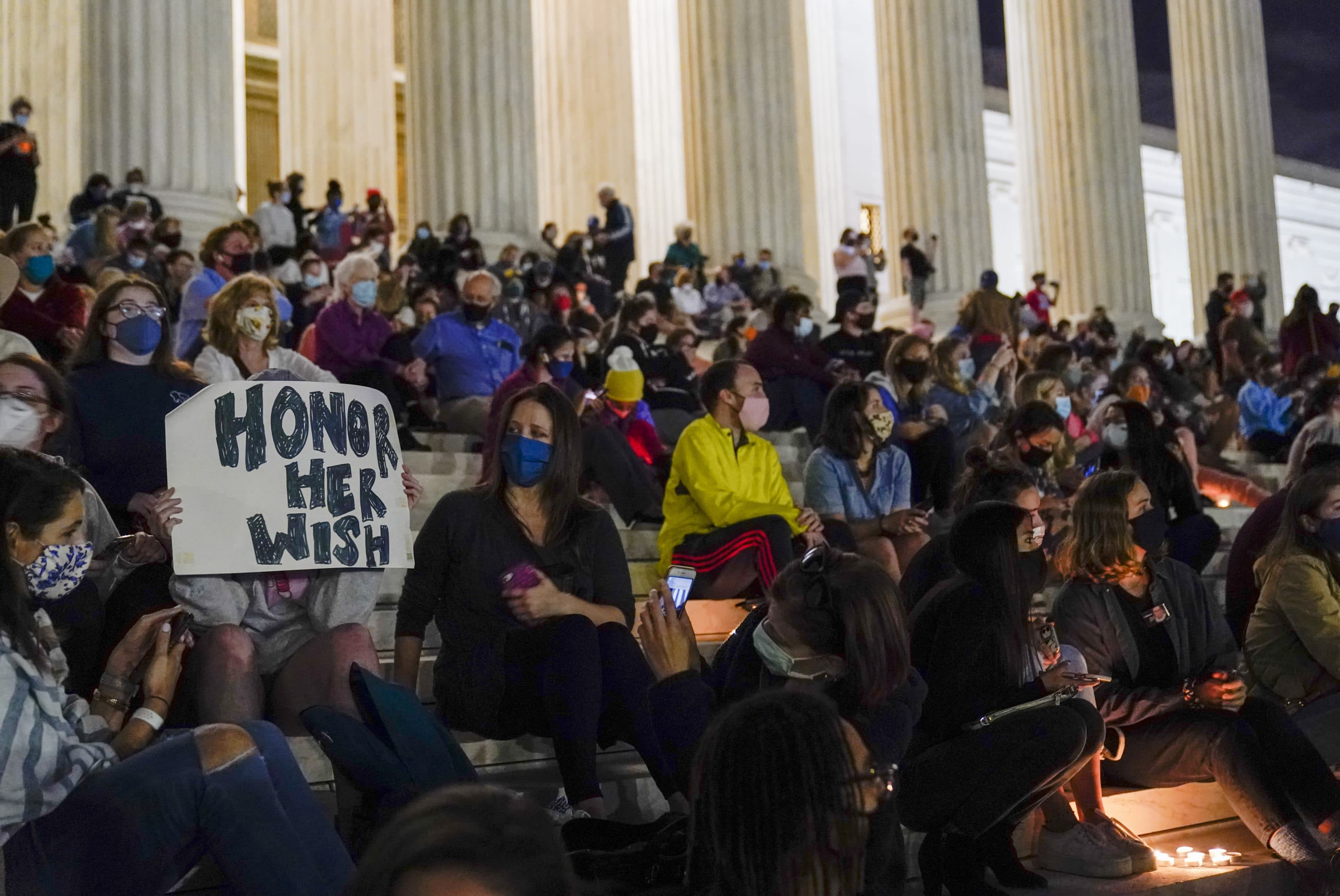 People gather at the Supreme Court Friday, Sept. 18, 2020, in Washington, after the Supreme Court announced that Supreme Court Justice Ruth Bader Ginsburg has died of metastatic pancreatic cancer at age 87. (Alex Brandon/AP)