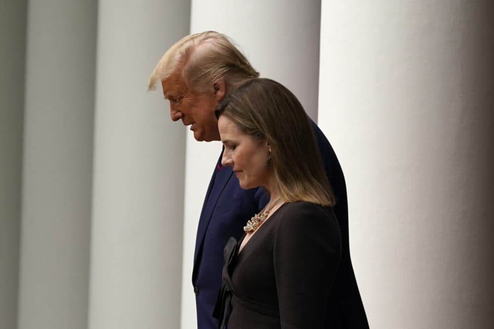 President Donald Trump walks with Judge Amy Coney Barrett to a news conference to announce Barrett as his nominee to the Supreme Court, in the Rose Garden at the White House, Saturday, Sept. 26, 2020, in Washington. (Alex Brandon/AP)