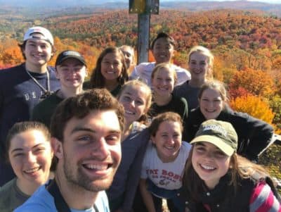 The author, far right, middle row, with triathlon teammates on a hike to Gile fire tower in 2019. (Courtesy)