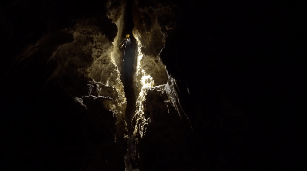 Sonia Meyer rappels down from Chocolate High in Carlsbad Caverns National Park after surveying (Photo by Derek Bristol)