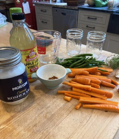 Preparing to can carrots and beans. (Kathy Gunst/Here &amp; Now)