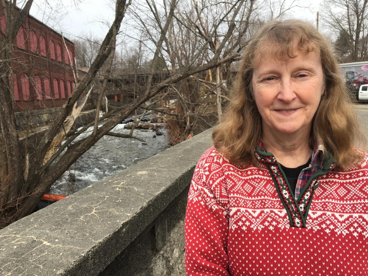 Jane Winn, executive director of Berkshire Environmental Action Team, stands next to the West Branch of the Housatonic River, where an old dam was removed in spring 2020. (Nancy Eve Cohen, NEPM)