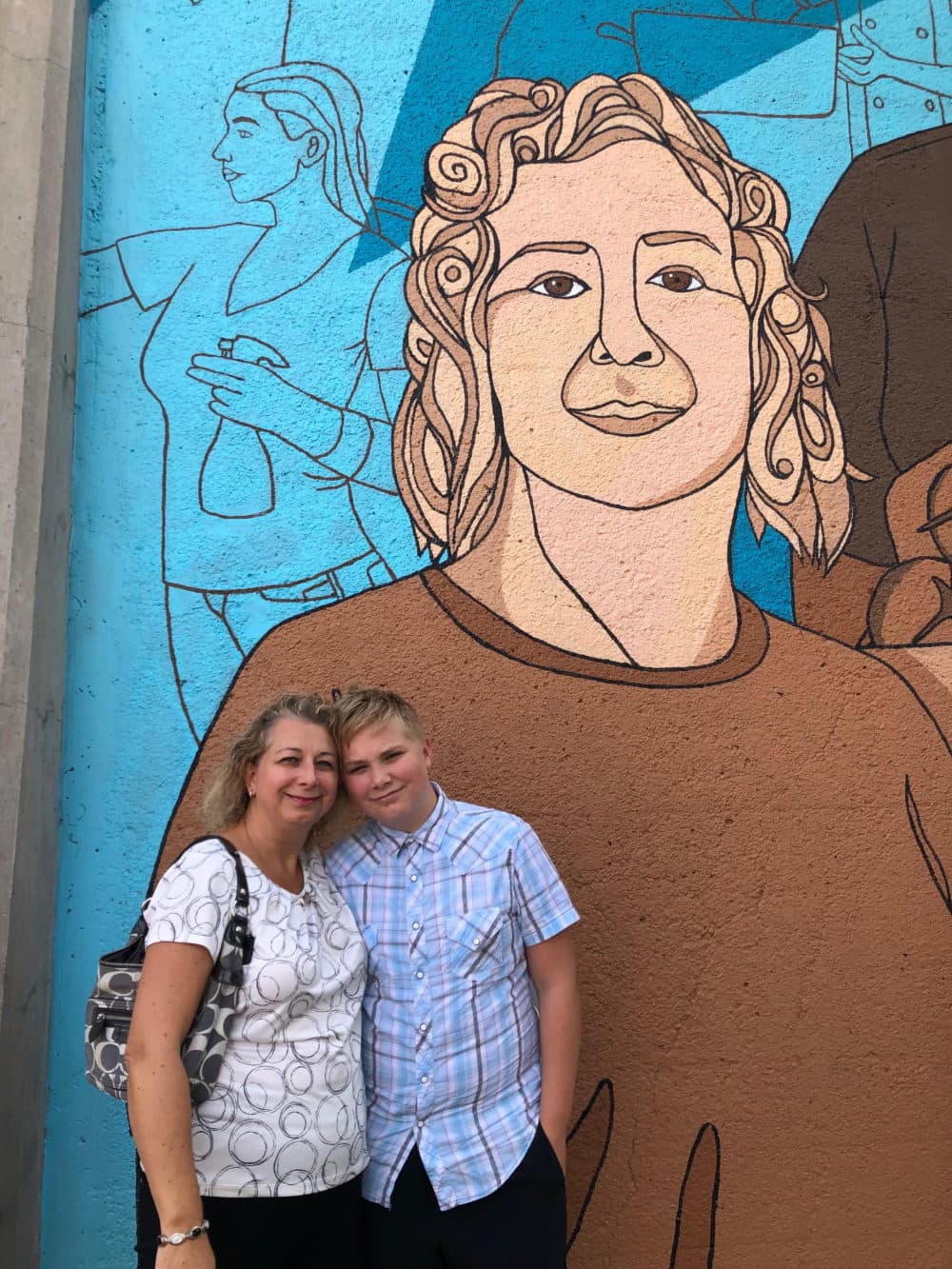 Maggie Zylinska and her 12-year-old son who she has to take with her to house cleaning jobs because there's no child care or school right now. (Courtesy)