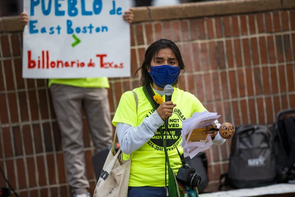 Organizer and East Boston resident Gabriela Cartagena speaks to supporters during a rally in front of City Hall. (Jesse Costa/WBUR)