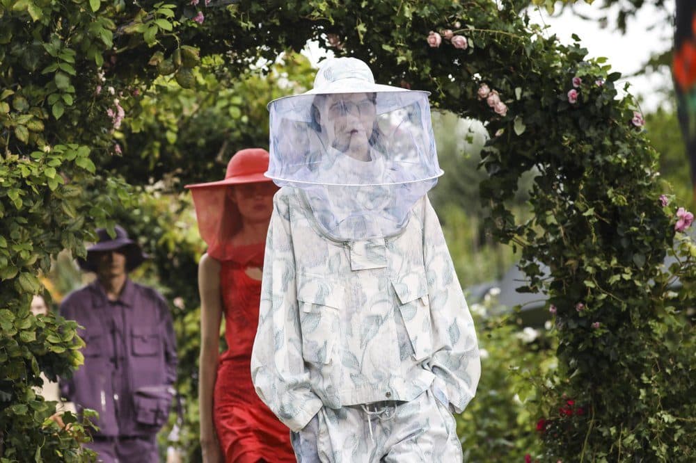 In this Wednesday, Sept. 30, 2020 file photo, models wear creations for the Kenzo Spring-Summer 2021 fashion collection, during Paris fashion week. Fashion designer Kenzo Takada dies from COVID-19 complications at age 81 near Paris, spokeswoman and reports said Sunday Oct. 4, 2020. (Vianney Le Caer/Invision/AP)