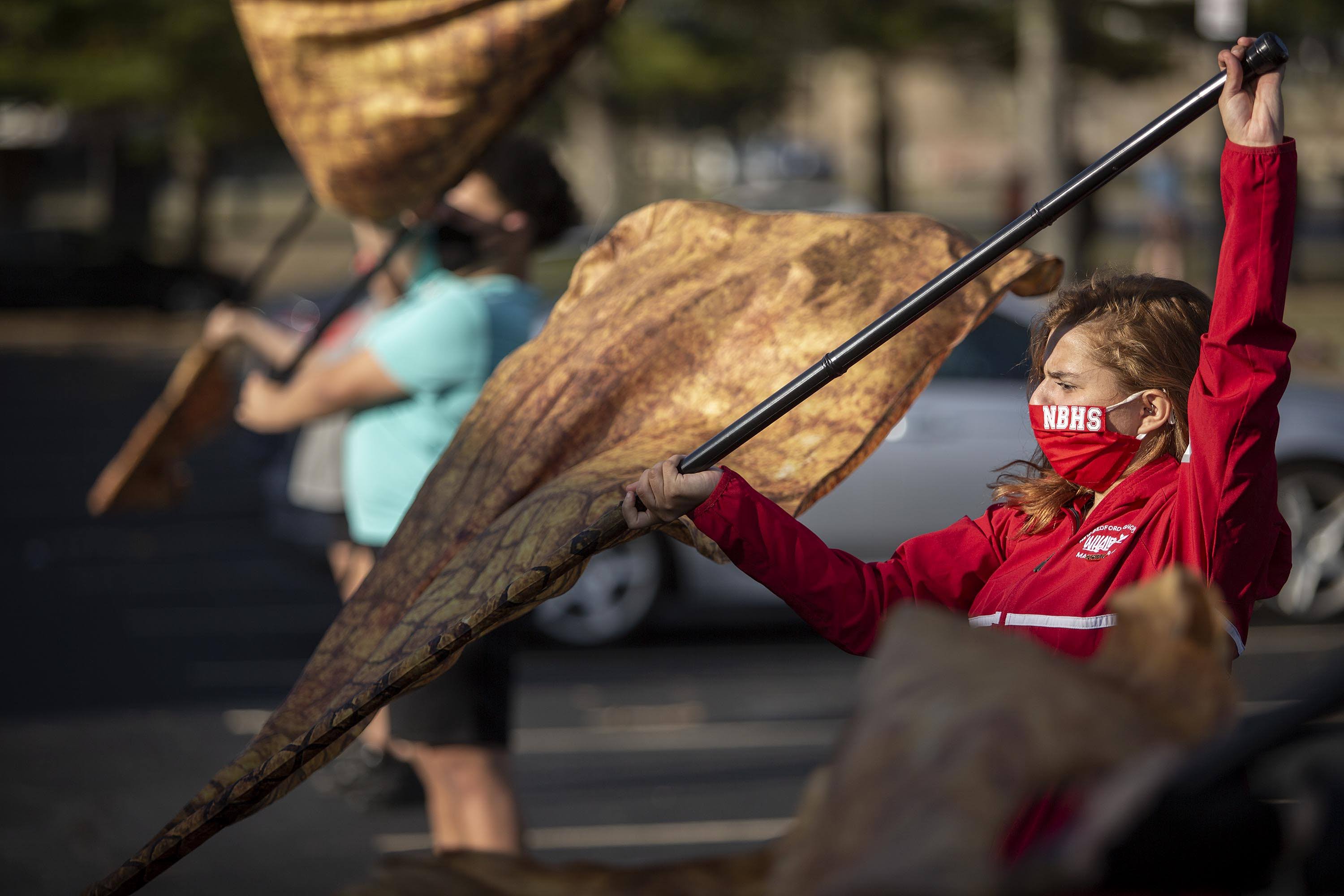 Madison Costa practices with the color guard at New Bedford High School. (Robin Lubbock/WBUR)