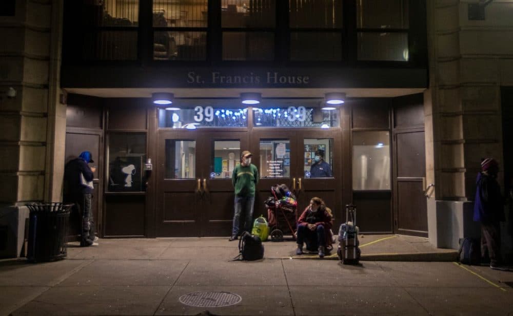 Clients of St. Francis House wait for the shelter to open in the early morning. (Jesse Costa/WBUR)