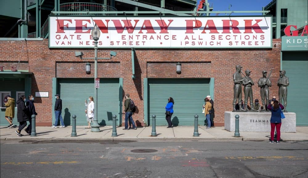 Early voters line up to cast their ballots outside of Fenway Park on Saturday, Oct. 17 in Boston. (Robin Lubbock/WBUR)