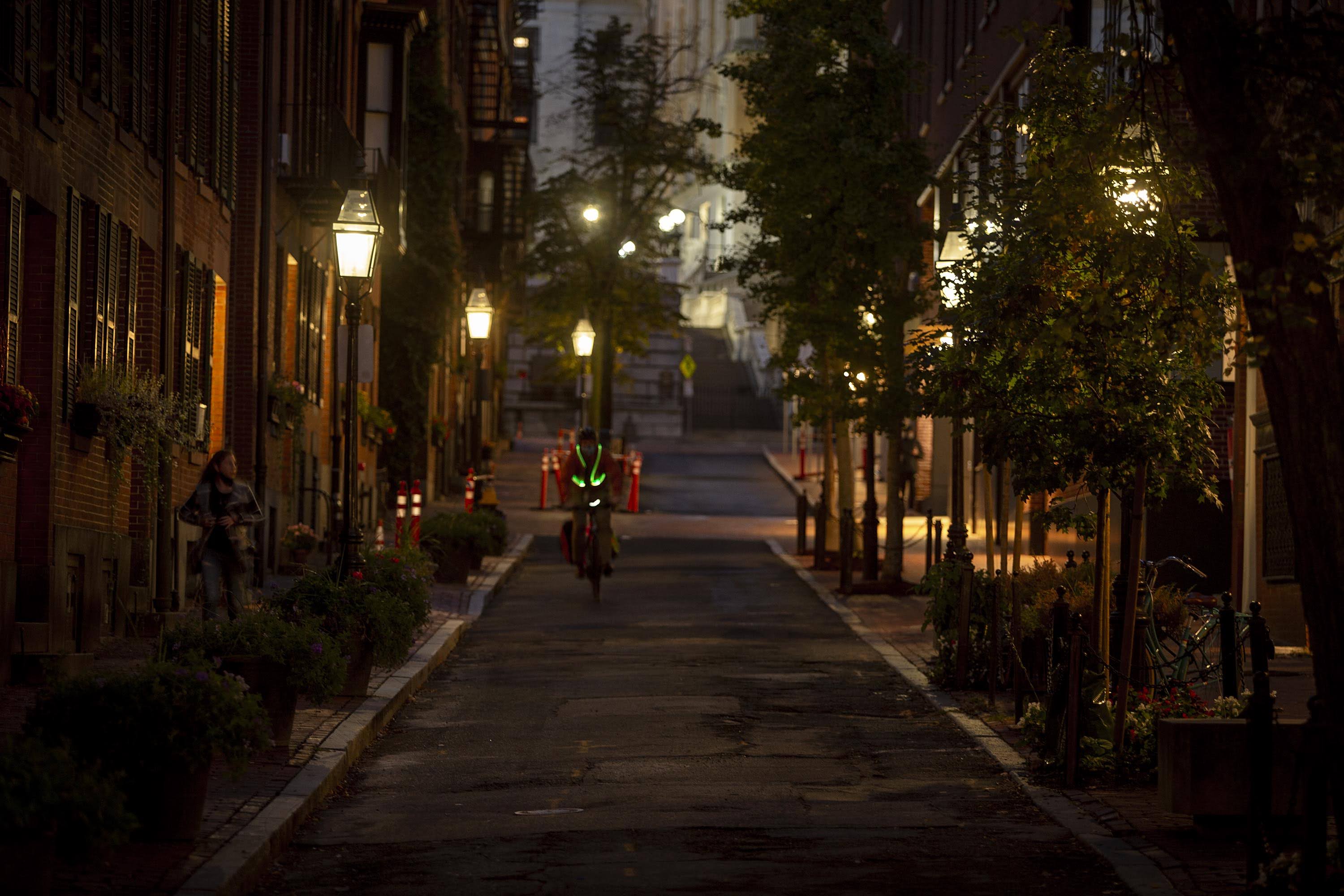Gas lamps illuminate Temple Street in Boston's Beacon Hill on a fall evening. (Robin Lubbock/WBUR)