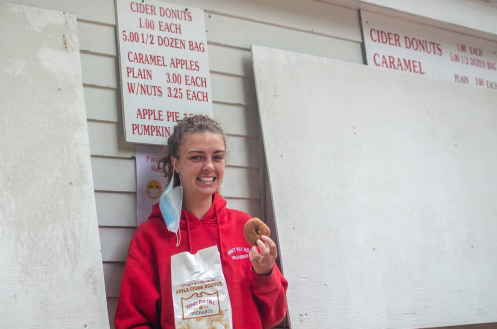Chelcie Martin, general manager of Honey Pot Hill Orchards, ready to sample her own wares. (Sharon Brody/WBUR)