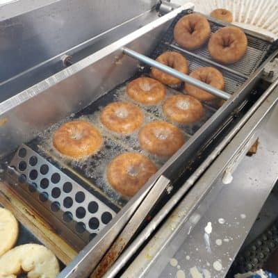 Cider doughnuts in the cooker at Honey Pot Hill Orchards in Stow, Massachusetts. (Courtesy)