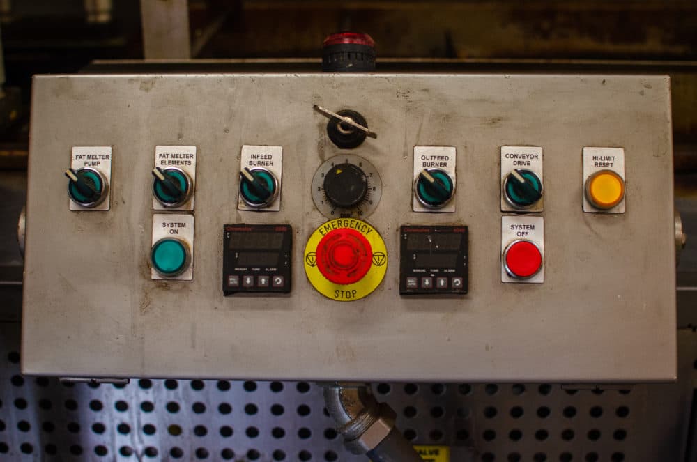 The controls on the machine where the cider doughnut magic happens at Honey Pot Hill Orchards. (Sharon Brody/WBUR)