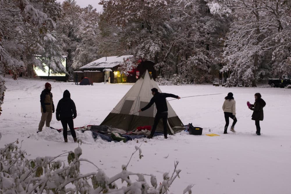 A group of die hard horror fans set up their tent and get ready to camp in the snow for the Coolidge Corner Theater’s “Cabin of the Rocky Horror in the Woods” double feature. (Jenn Stanley)