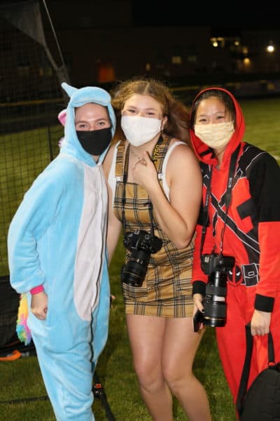 Students taking photos for the yearbook on costume night at a high school in Clinton County, Iowa. (Scott Hoag Photography)