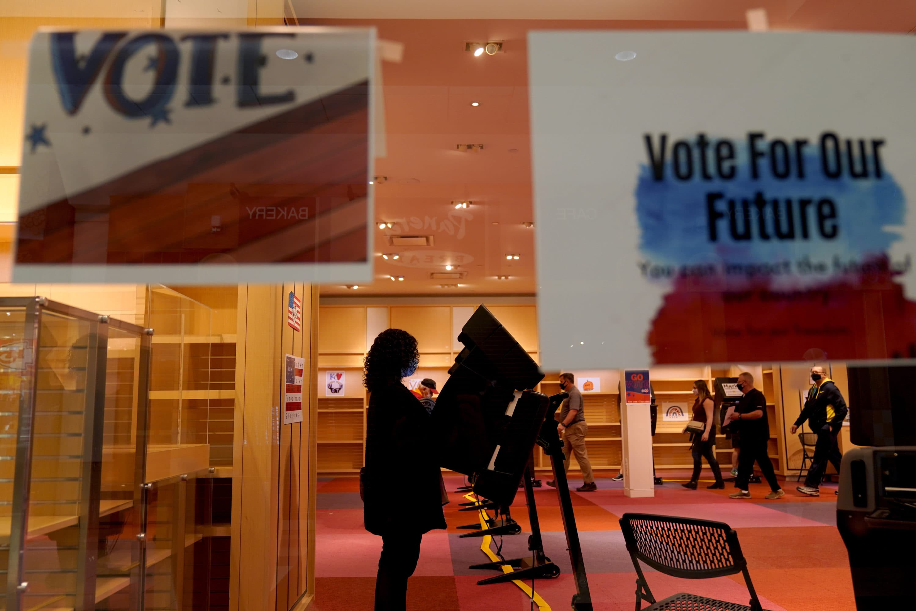 In this Oct. 17 photo, a woman casts her ballot on the first day of early voting in Overland Park, Kan. As it has for more than 170 years, The Associated Press will count the vote and report the results of presidential, congressional and state elections on Nov. 3 and beyond. (Charlie Riedel/AP File)