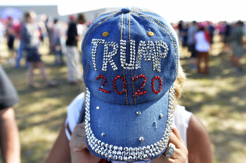 A woman shows off her bedazzled hat during a Trump campaign rally at Manchester airport in Londonderry, New Hampshire, in 2020. (Joseph Prezioso/AFP/Getty Images)