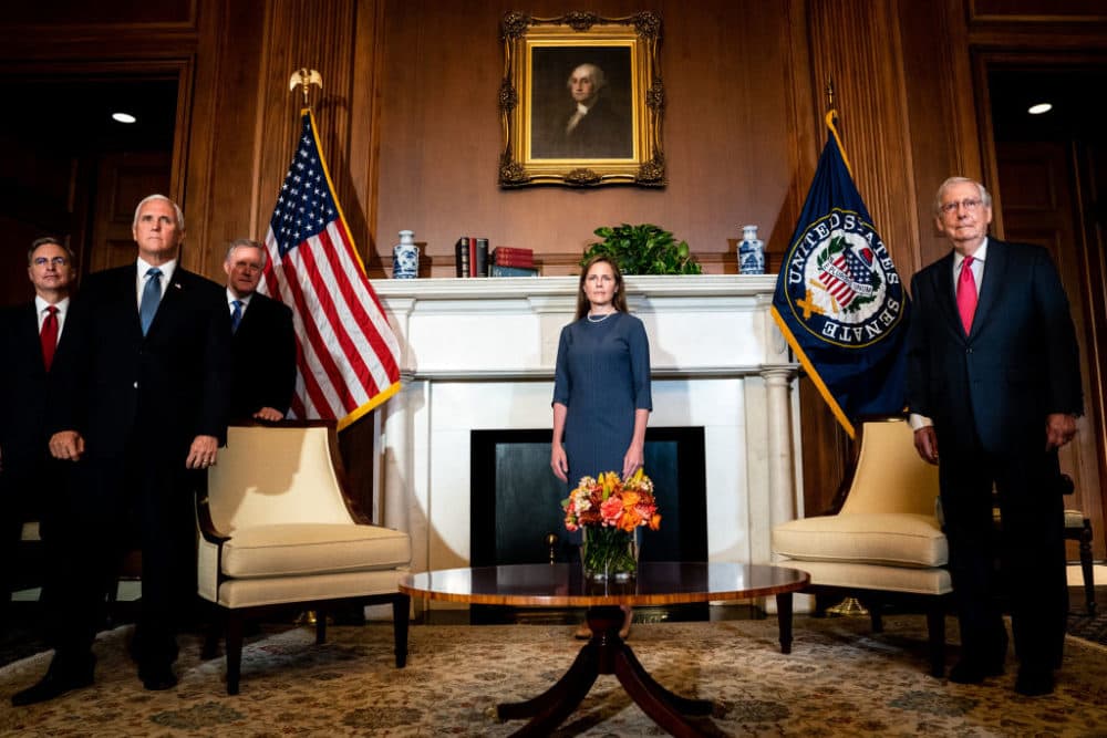 Judge Amy Coney Barrett, President Donald Trump's nominee for the U.S. Supreme Court, poses with Vice President Mike Pence (L) and Senate Majority Leader Mitch McConnell (R-KY) (R) at the U.S. Capitol during a series of meetings with senators in preparation for her confirmation hearing, on September 29, 2020 in Washington, DC. (Erin Schaff-Pool/Getty Images)