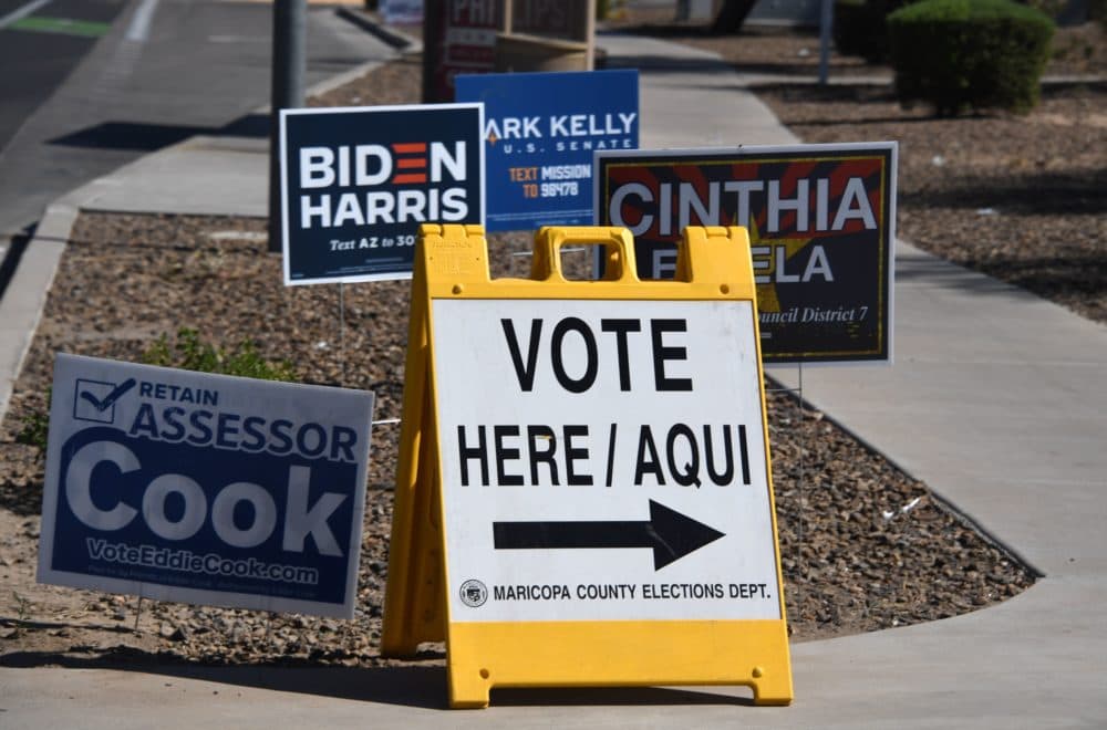 A sign points the way to an early voting location in Phoenix, Arizona on Oct. 16, 2020 ahead of the US presidential election. (Robyn Beck/AFP via Getty Images)