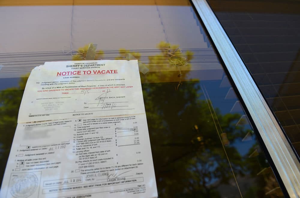 A &quot;Notice to Vacate&quot; is seen in the window of a home in Glendale, California. (Robyn Beck/AFP/Getty Images)