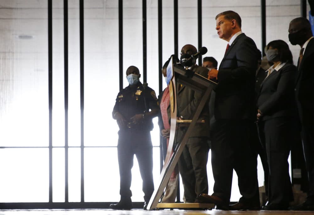 Mayor Marty Walsh spoke at a press conference flanked by members of the Boston Police Reform Task Force as he announced a plan for a slate of reforms to the Boston Police Department. (Jessica Rinaldi/Globe Staff/Pool)