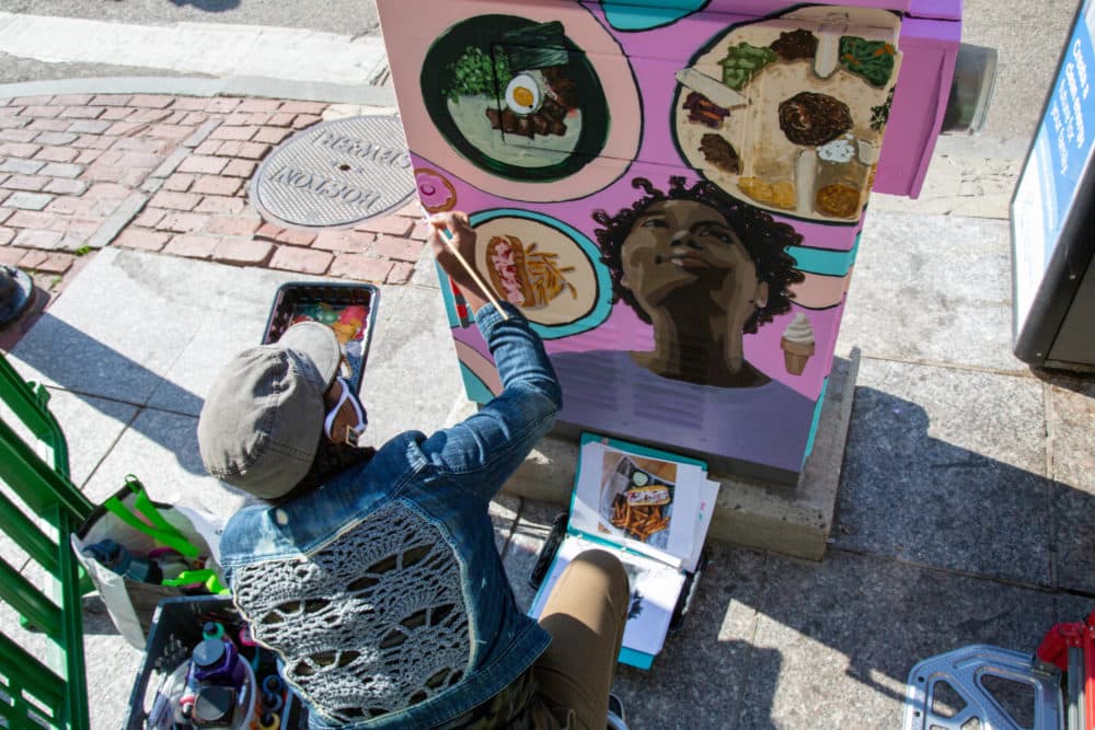 Artist Robyn Thompson-Duong painting a utility box located on the corner of Tremont and Winter streets. (Courtesy Downtown Boston BID)