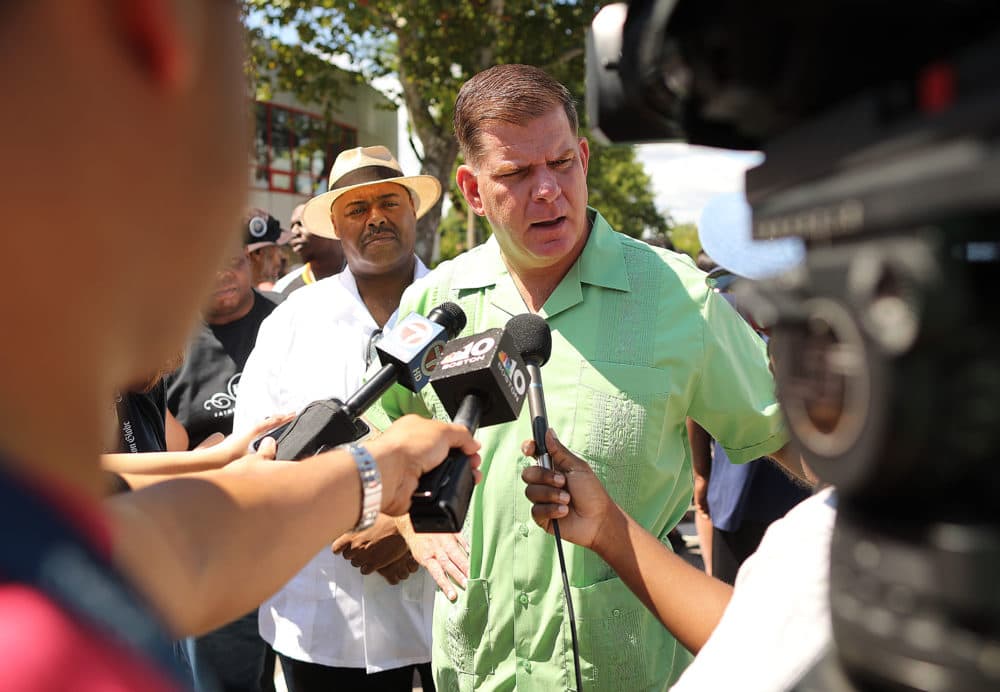 On Aug. 24, 2019, Boston Mayor Marty Walsh speaks to reporters about the series of shootings that occurred in a Boston neighborhood overnight as Boston Police Commissioner William Gross looks on. (John Tlumacki/The Boston Globe via Getty Images)
