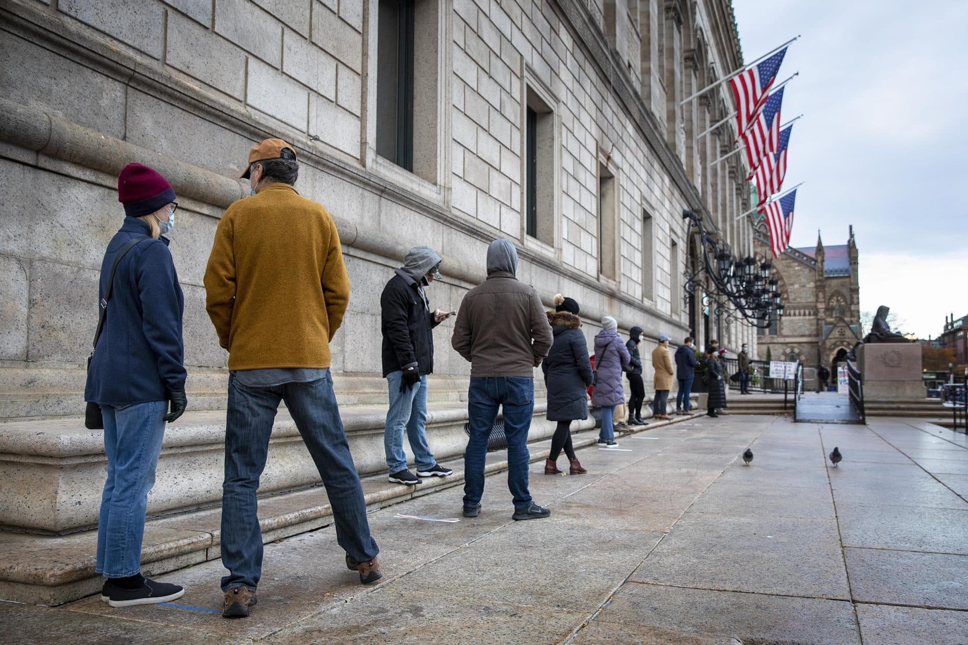 Voters line up to cast ballots at the Boston Public Library. (Robin Lubbock/WBUR)