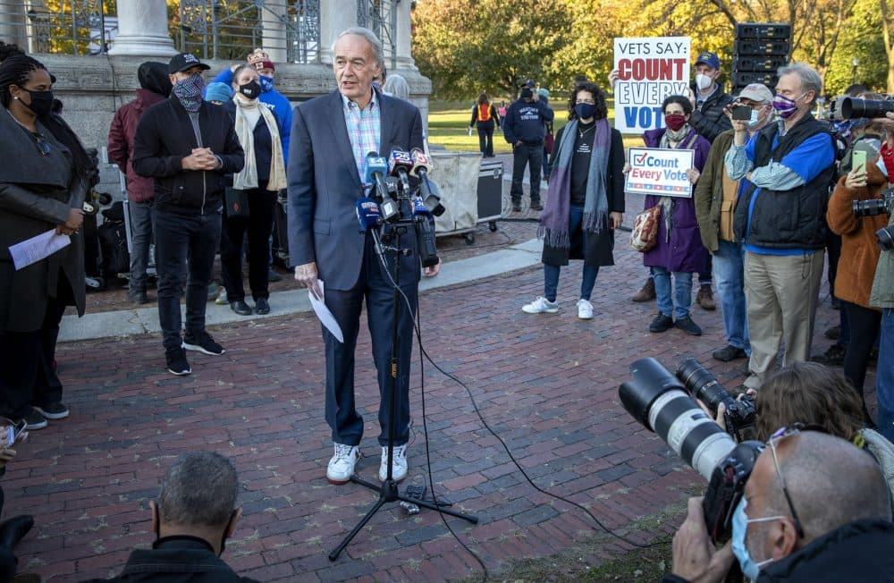 Senator Ed Markey and his sneakers talk to the press at a rally on Boston Common. (Robin Lubbock/WBUR)
