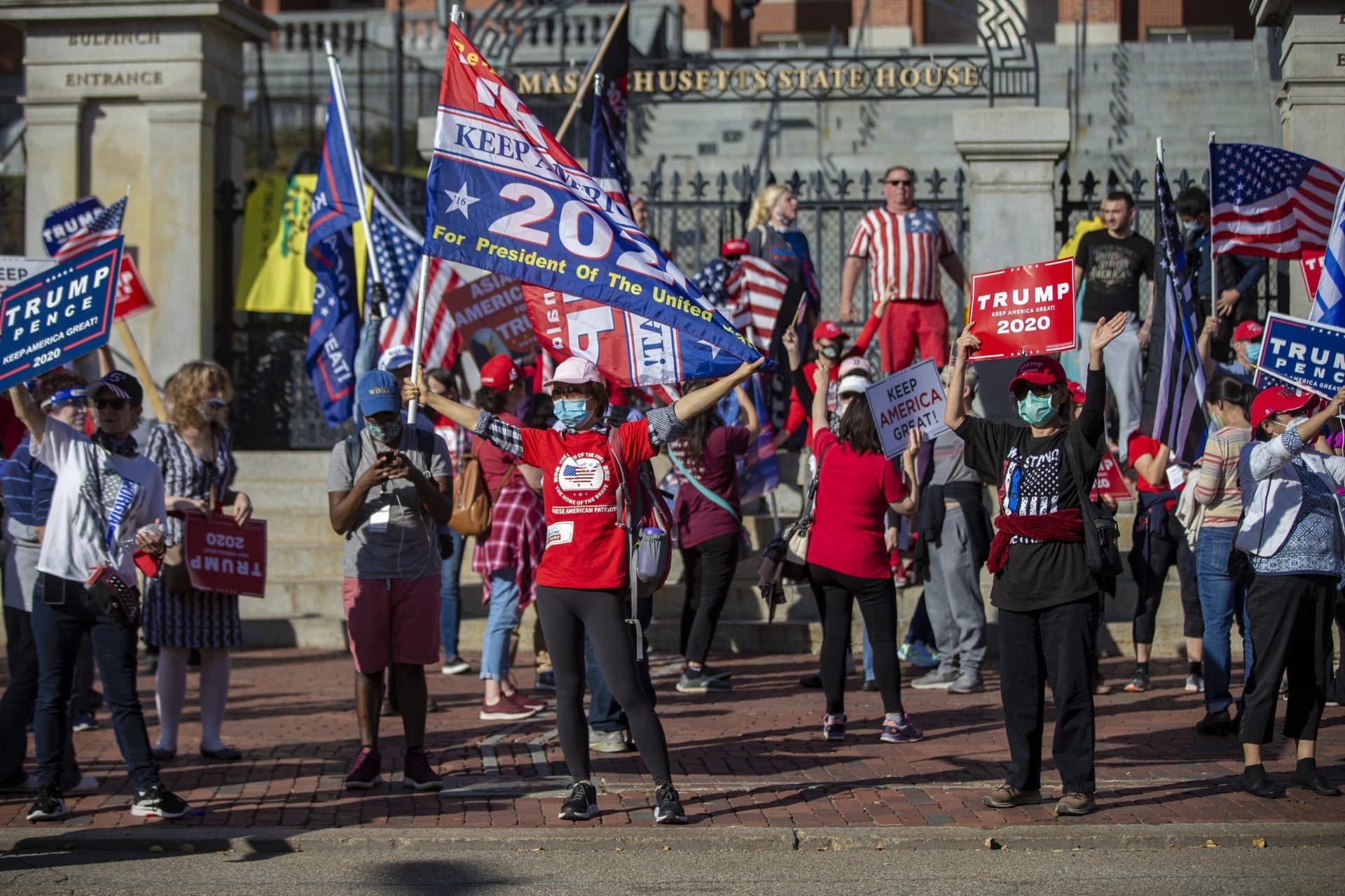 Trump supporters rally in front of the Massachusetts State House after the announcement that Joe Biden has won the presidential election. (Jesse Costa/WBUR)