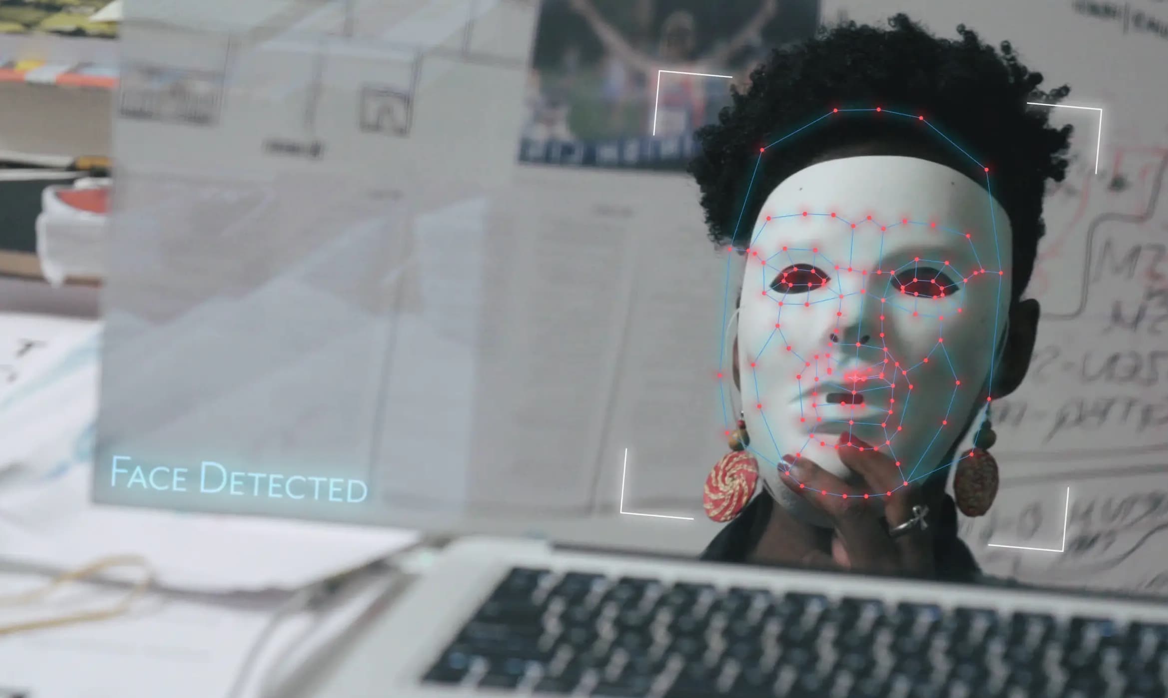 Joy Buolamwini wearing a mask to test facial recognition software. (Courtesy 7th Empire Media)