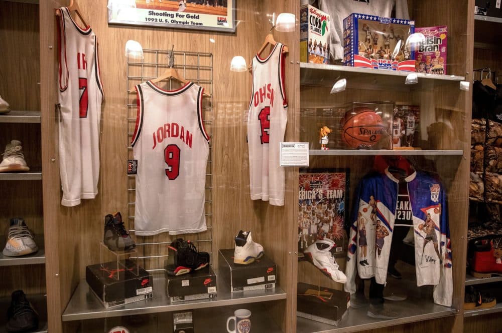 Bird, Jordan and Johnson jerseys at the Dream Team display at Laced in Copley Place. (Robin Lubbock/WBUR)