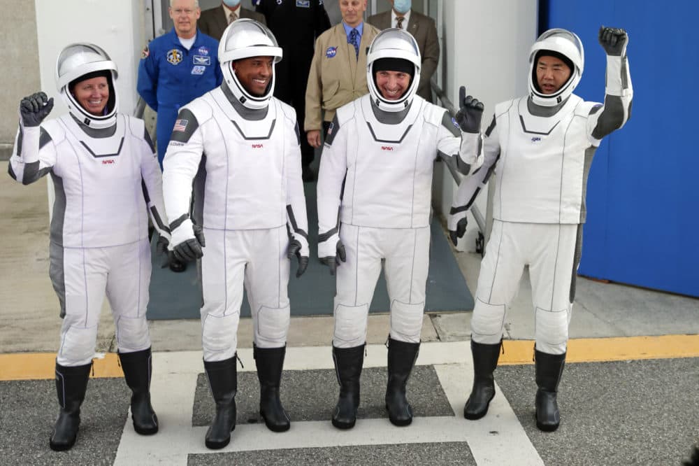 NASA astronauts, from left, Shannon Walker, Victor Glover, and Michael Hopkins and Japan Aerospace Exploration Agency astronaut Soichi Noguchi leave the Operations and Checkout Building on their way to launch pad 39A for the SpaceX Crew-1 mission to the International Space Station at the Kennedy Space Center in Cape Canaveral, Fla., Sunday, Nov. 15, 2020. (John Raoux/AP)