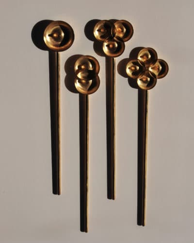 Suna Bonometti's four brass &quot;donut spoons.&quot; (Courtesy of the artist and Fuller Craft Museum)