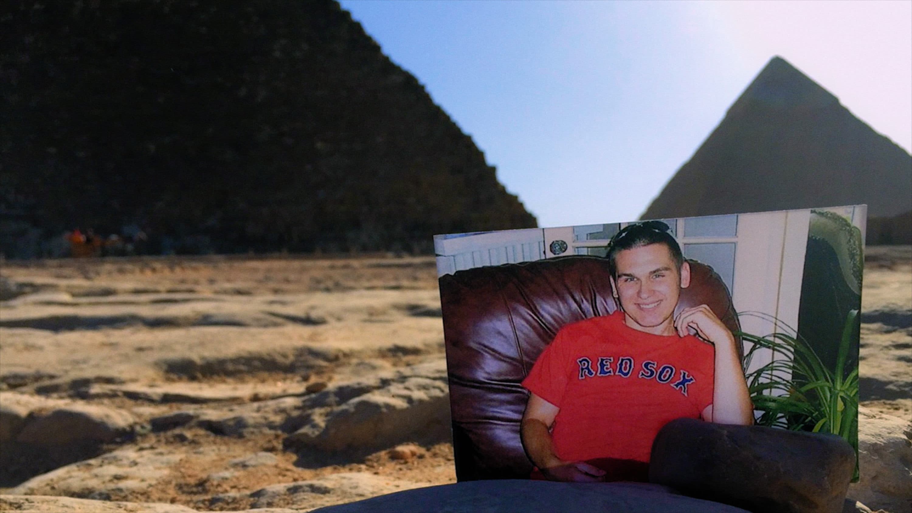 A photograph of CJ in front of the Pyramid of Giza. (Courtesy Spark Media)