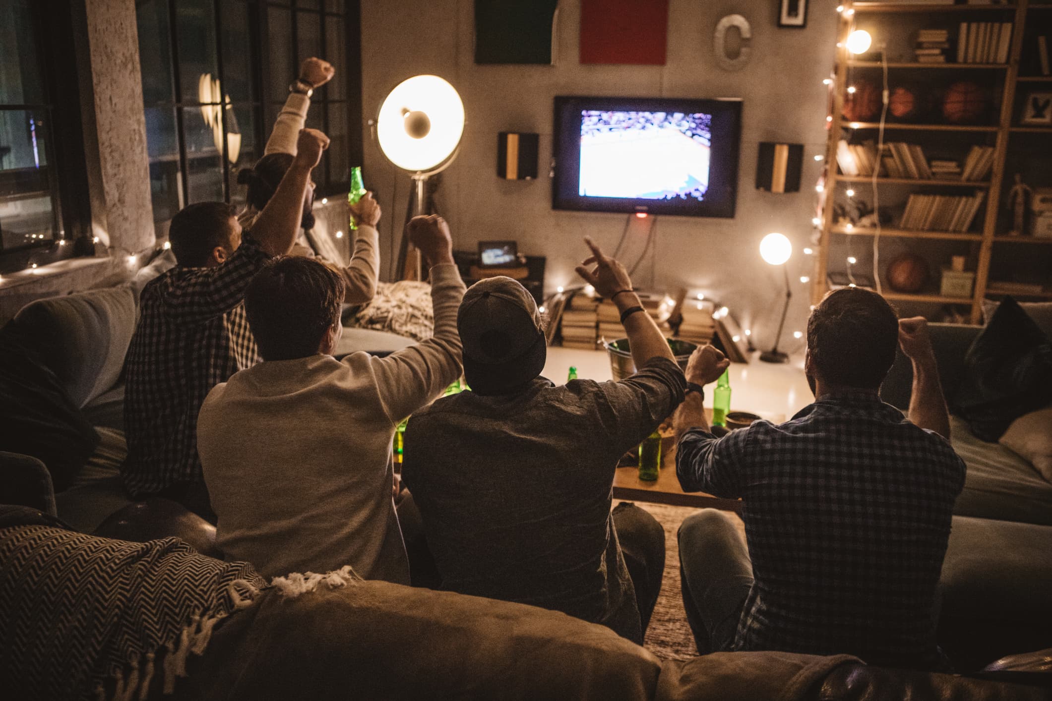 A recent survey of Mass. residents found that about 45% of respondents said they had been indoors with someone they didn't live with. Experts say indoor, unmasked gatherings are driving much of the coronavirus uptick in Massachusetts. (Getty Images)
