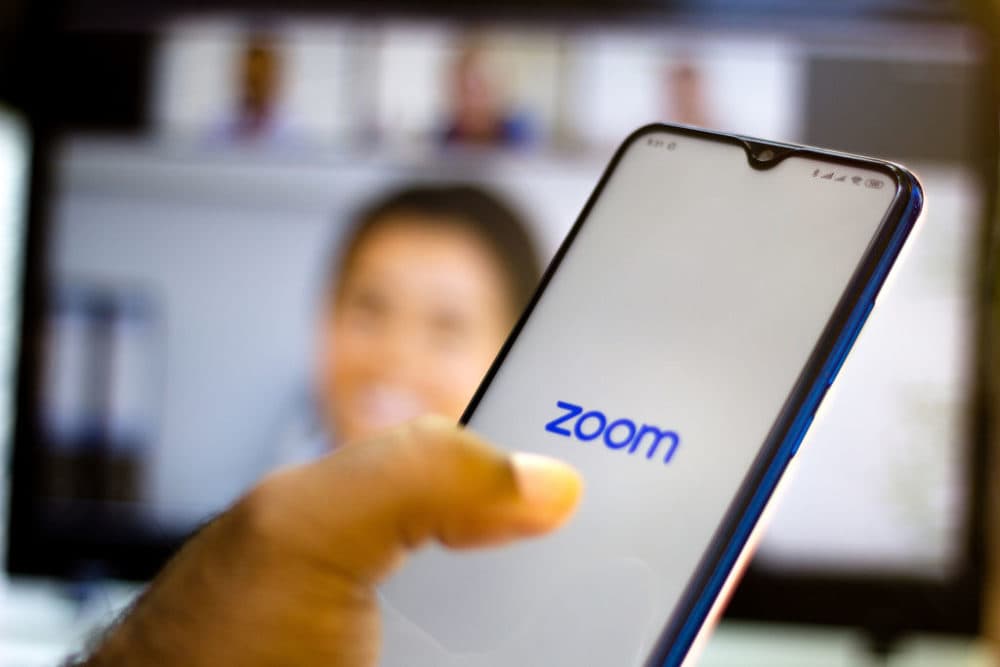 In this photo illustration, a Zoom logo is seen displayed on a smartphone. (Photo illustration by Rafael Henrique/SOPA Images/LightRocket via Getty Images)
