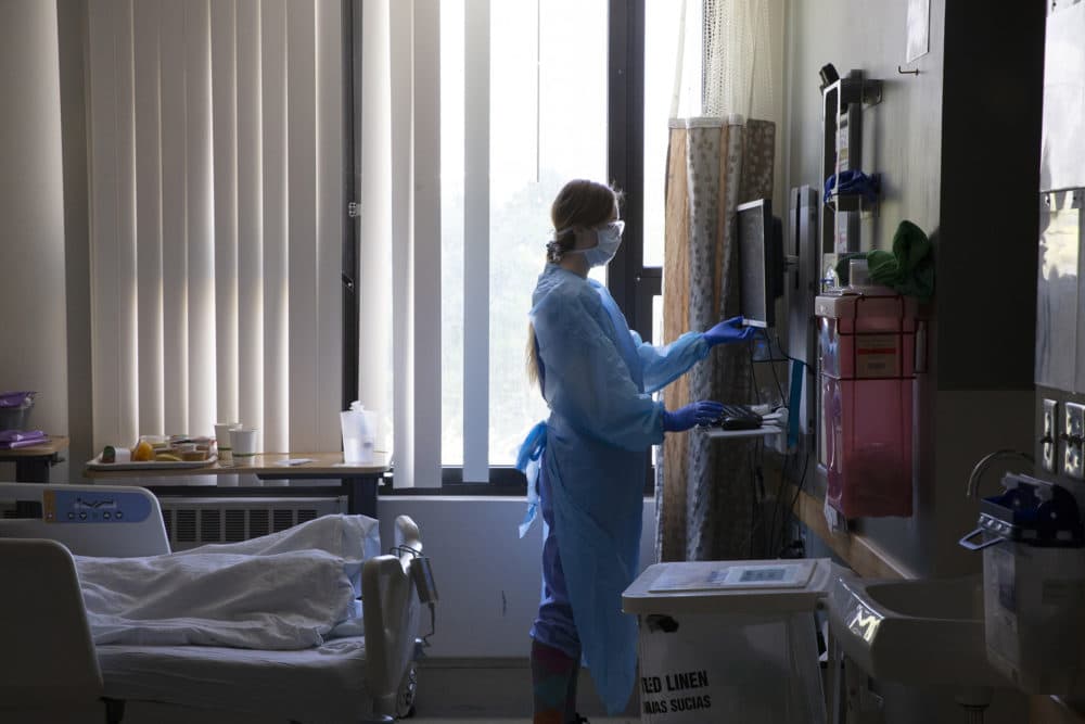 A nurse administers care to a patient in the acute care COVID unit at Harborview Medical Center on May 7, 2020 in Seattle, Washington. (Karen Ducey/Getty Images)