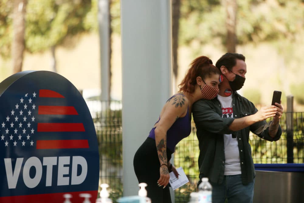 LOS ANGELES, CA - NOVEMBER 03: Yael Vengroff, left, and Paul Piane, right, take a selfie after voting at the Hollywood Bowl Vote Center in Hollywood on Tuesday, Nov. 3, 2020 in Los Angeles, CA.(Dania Maxwell / Los Angeles Times via Getty Images)