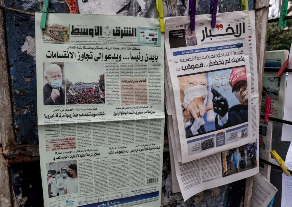 This picture taken on November 8, 2020 shows a view of international Arabic newspaper Asharq Al-Awsat (L) and Lebanese newspaper al-Akhbar (R) along a stand in Lebanon's capital Beirut, with headlines featuring the 2020 US general election results. (ANWAR AMRO/AFP via Getty Images)