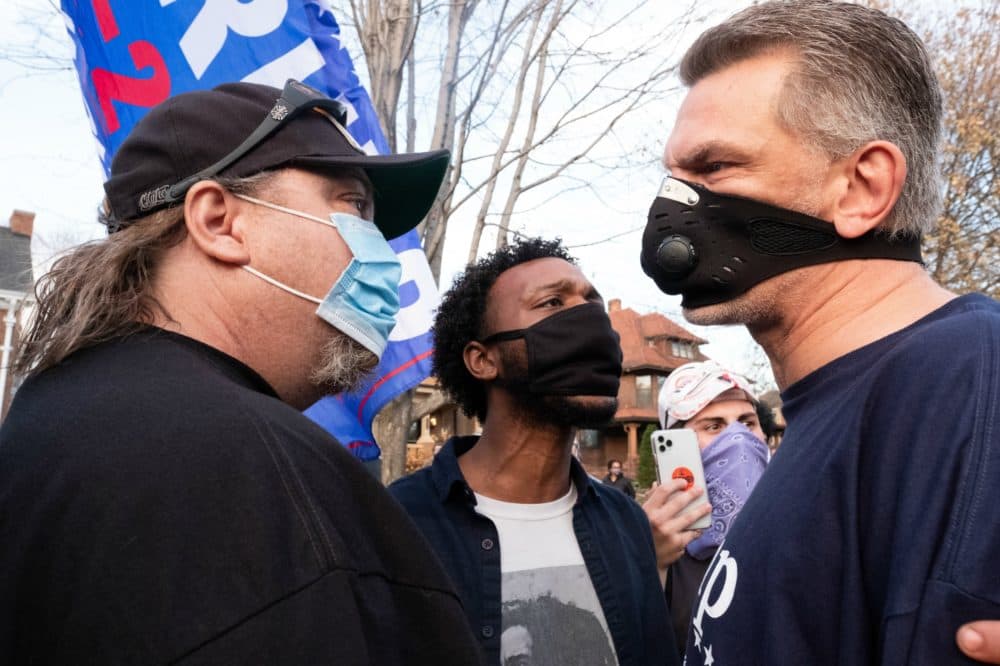 A Trump supporter argues with counter protesters in St. Paul, MN. November 7, 2020. Supporters of Donald Trump -- including a number of outspoken conspiracy theorists -- gathered outside the Governor's Mansion in St. Paul, MN to reject Joe Biden's victory in the presidential election. Attendees argued with counter protestors while repeating many of Donald Trump's falsehoods regarding the integrity of the vote. (Tim Evans/NurPhoto via Getty Images)