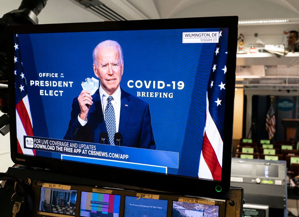 President-elect Joe Biden is shown speaking on a monitor about COVID-19 in the briefing room of the White House on November 9, 2020, in Washington, D.C. (Joshua Roberts/Getty Images)